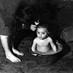 ילדה ב"אמבט" במחנה עקורים - A child bathing in a DP camp